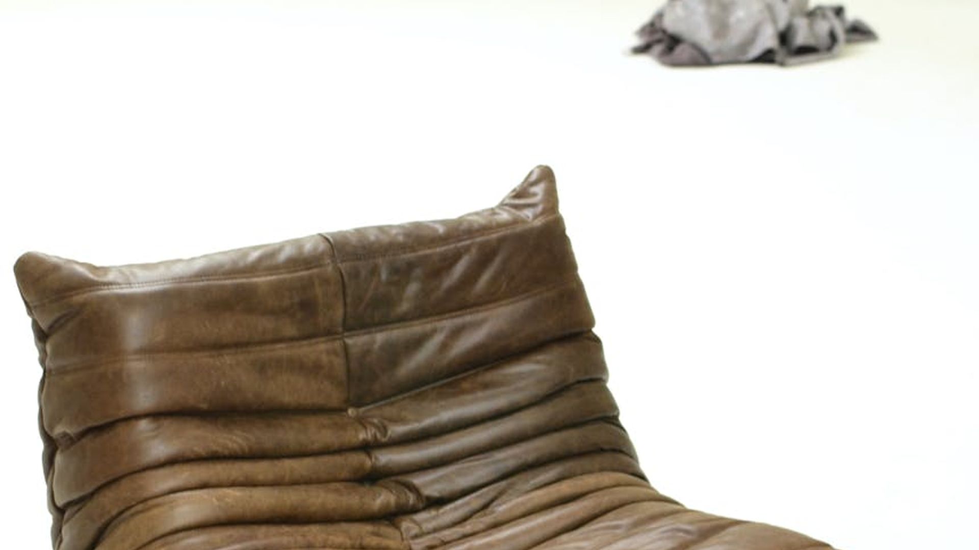 Spacious, minimalist studio with soft morning light.